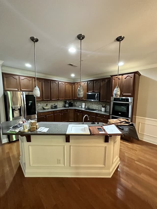 The original dark wood kitchen before the Coastal Chic transformation