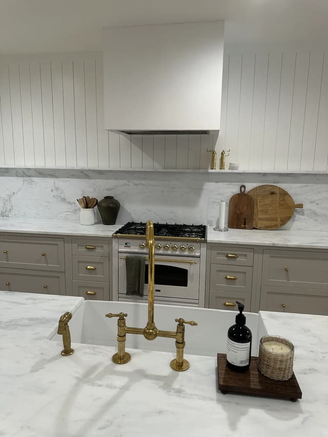 Island sink facing the tailored range wall