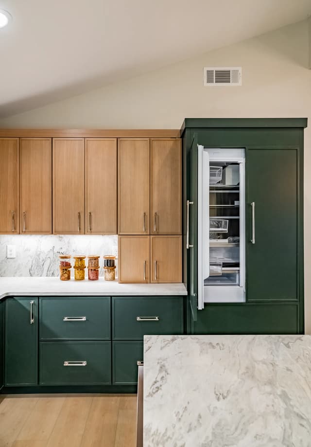 Integrated refrigeration within full-height emerald cabinetry