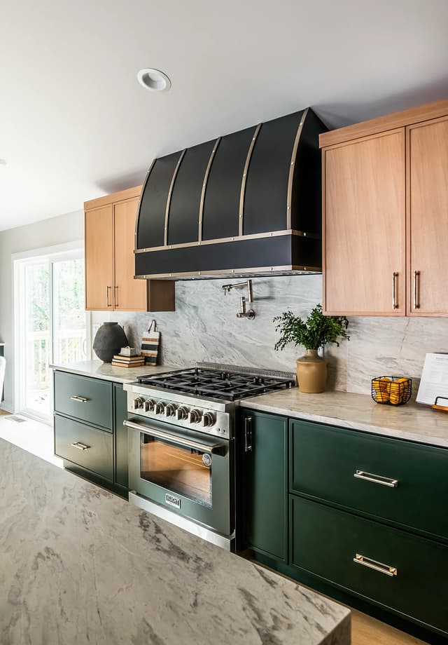 Angled view of the emerald range wall and natural oak cabinetry