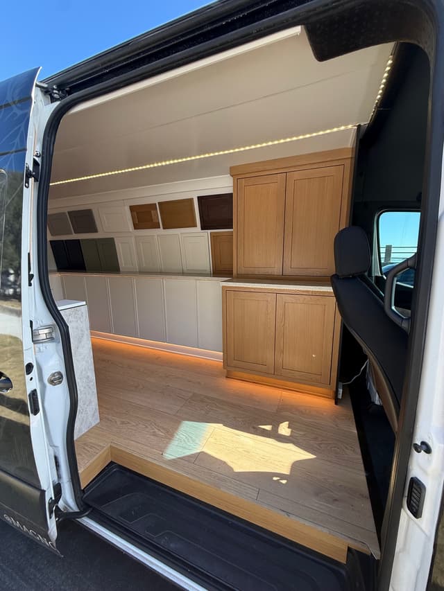 Cabinet door profiles arranged inside the mobile showroom